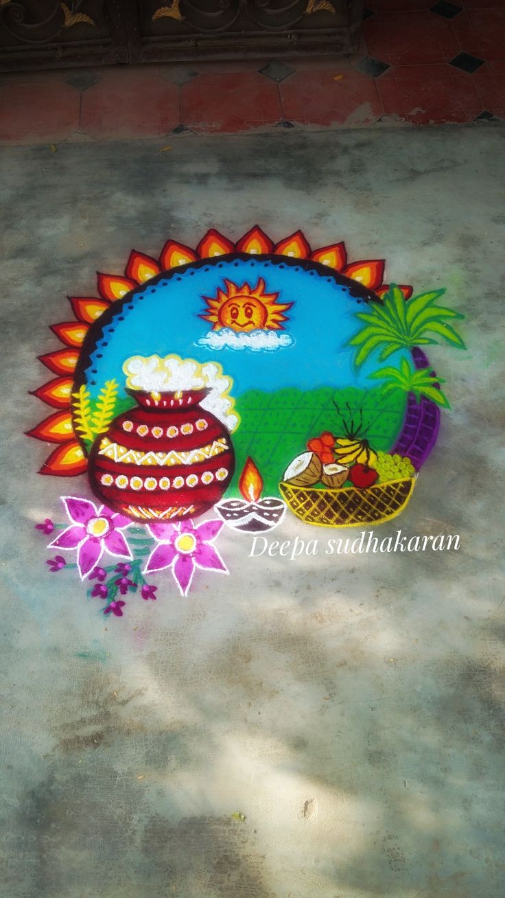 a colorful painting on the ground that says happy diwali with flowers and pot