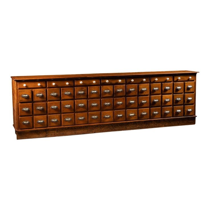 a large wooden cabinet with many drawers