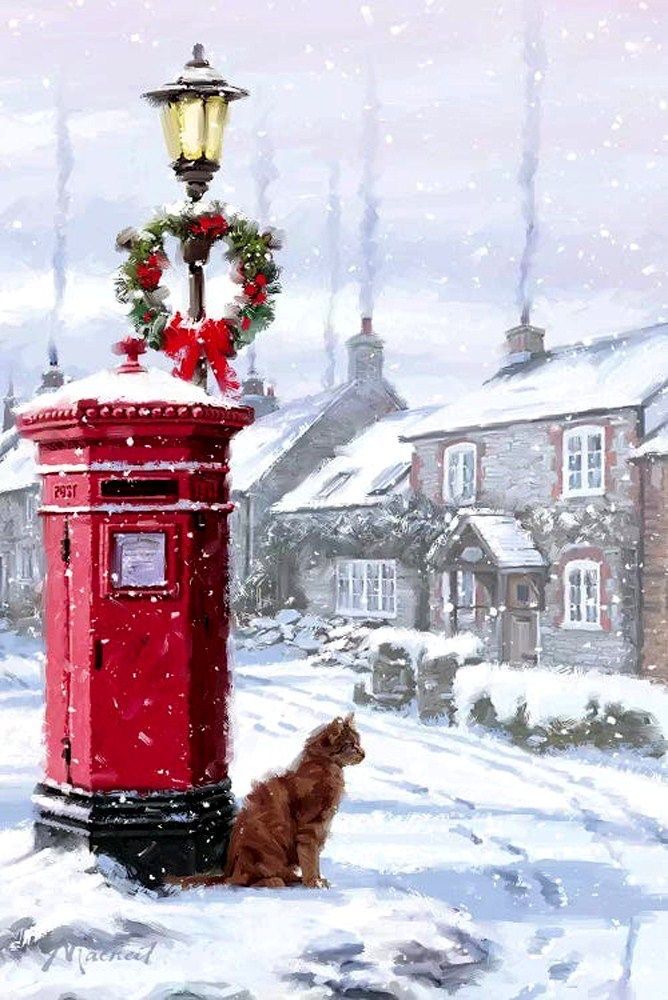 a dog sitting in the snow next to a red mailbox with a wreath on it