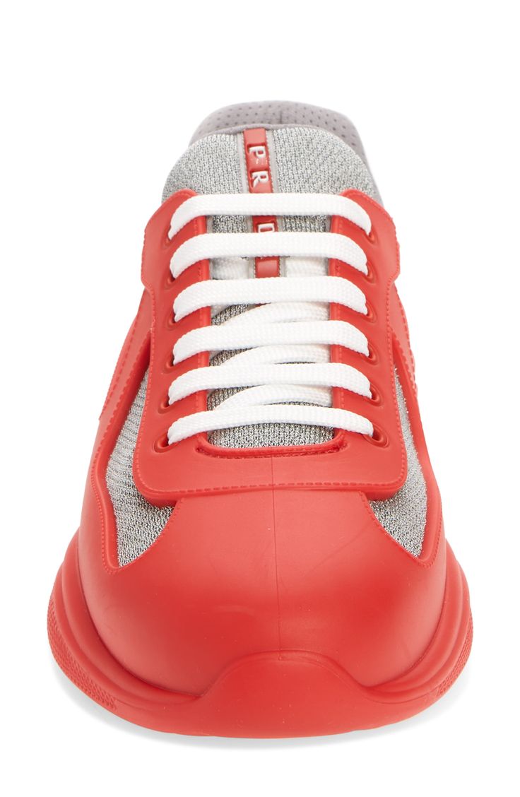 Made from colorful rubber and breathable mesh, this low-top sneaker was originally designed in the '90s for the America's Cup Luna Rossa sailing team. Lace-up style Removable insole Rubber and recycled-polyester textile upper/textile and synthetic lining/rubber sole Made in Italy Men's Designer Shoes Prada Sneakers, America's Cup, Americas Cup, Mens Designer Shoes, Sneaker Men, Trainer Sneakers, Sneakers Blue, Mesh Design, Prada Shoes