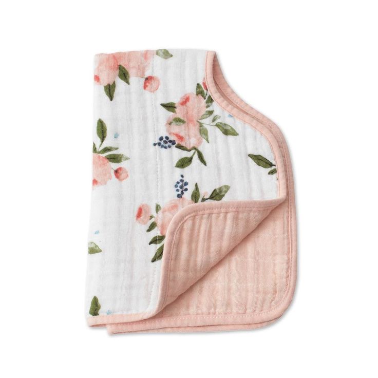 a blanket with pink flowers on it