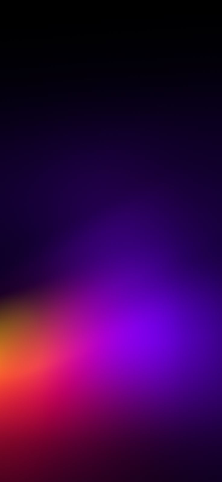 a blurry image of an orange and purple background with the light reflecting on it