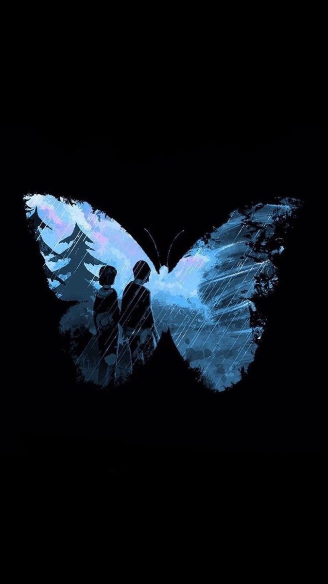 two people standing next to each other in the dark with a butterfly flying over them