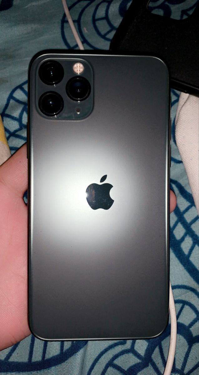 an apple phone is being held in someone's hand with the camera attached to it