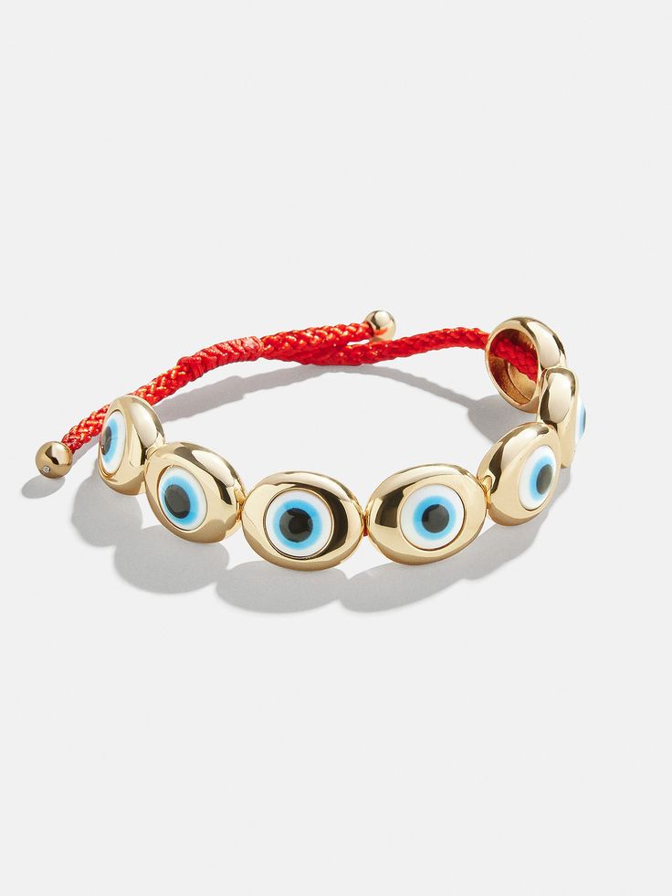 Extra eyes never hurt. The Eye to Eye Bracelet guards your energy — while adding classic gold finishes to your arm candy. Easily pull the red tie to adjust the size to your wrist. Trendy Red Resizable Jewelry, Gold Resizable Round Evil Eye Bracelet, Gold Evil Eye Bracelet With Adjustable Length As Gift, Gold Evil Eye Bracelet For Friendship, Gold Round Evil Eye Bracelet For Friendship, Trendy Gold Bracelets With Adjustable Band, Gold Evil Eye Bracelet With Sliding Knot As Gift, Adjustable Yellow Gold Evil Eye Bracelet, Trendy Gold Bracelets With Evil Eye