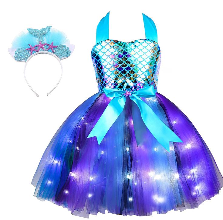 PRICES MAY VARY. 【UNIQUE MERMAID DRESS DESIGN】 Davsolly mermaid dress was designed for those toddler girls who love the mermaid story and have dream to be a mermaid princess. The led light up buttom makes this mermaid tutu dress outstanding, colorful headband adds story to the top. Trust the little girl will be a princess at the party! 【LIGHT UP THE NIGHT, LIGHT UP GIRLS DREAM】Fancy mermaid dress come with LED lights to light up the night. Let your little girl dress up herself, play, dance, have 4th Birthday Mermaid Theme, Mermaid Three Year Old Party, Whimsical Mermaid Tutu Dress For Birthday, Cute Mermaid Tutu Dress For Dress-up, Blue Mermaid Dress, Girls Mermaid Costume, Mermaid 9th Birthday Shirt, Purple Mermaid Tutu Dress For Dress-up, Mermaid Tutu