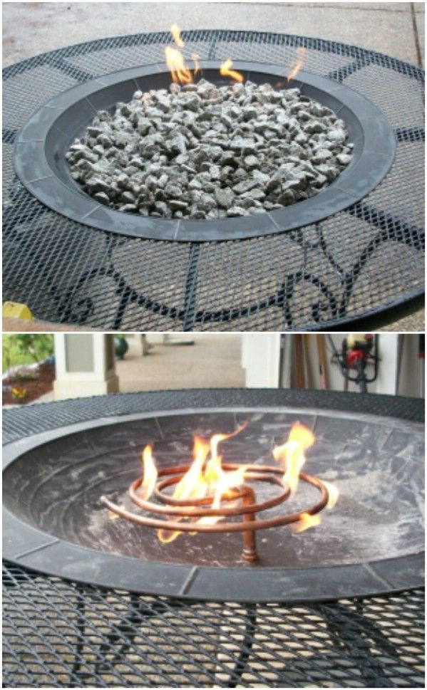 an outdoor fire pit is shown with flames coming out of the top and on to the bottom