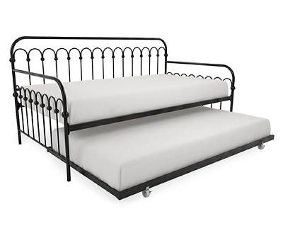 a blue metal daybed with two white pillows on the top and bottom, sitting next to each other