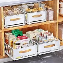 an organized kitchen cabinet filled with food items