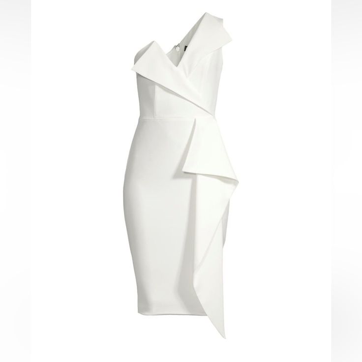 a white dress with an asymmetrical design on the front and side,