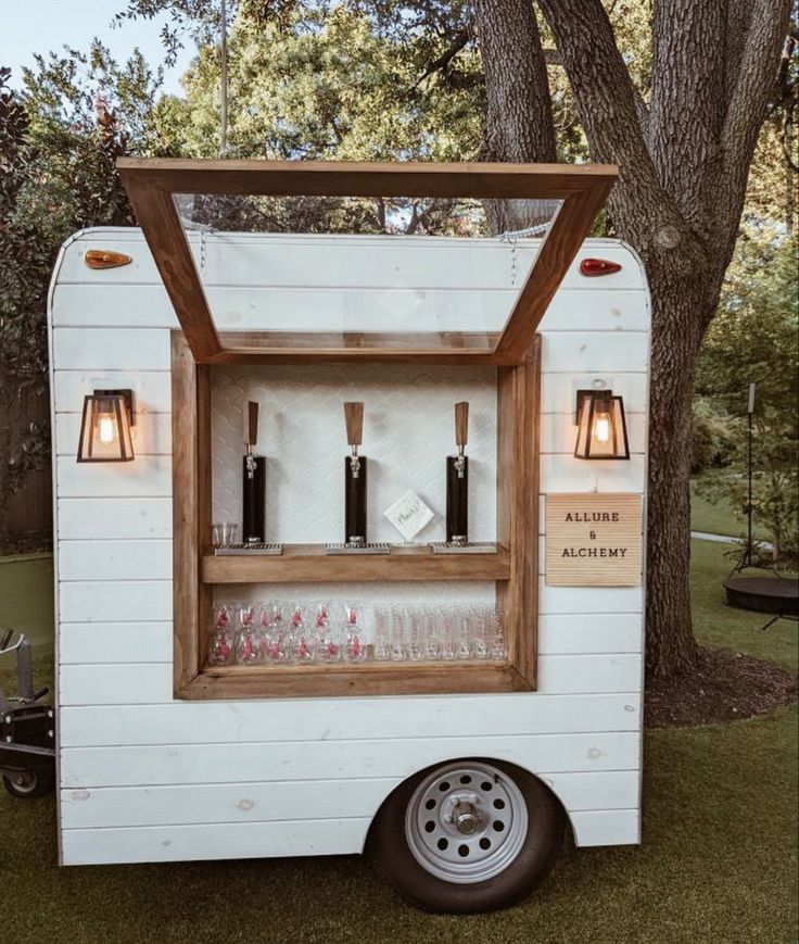 an old trailer converted into a mobile bar