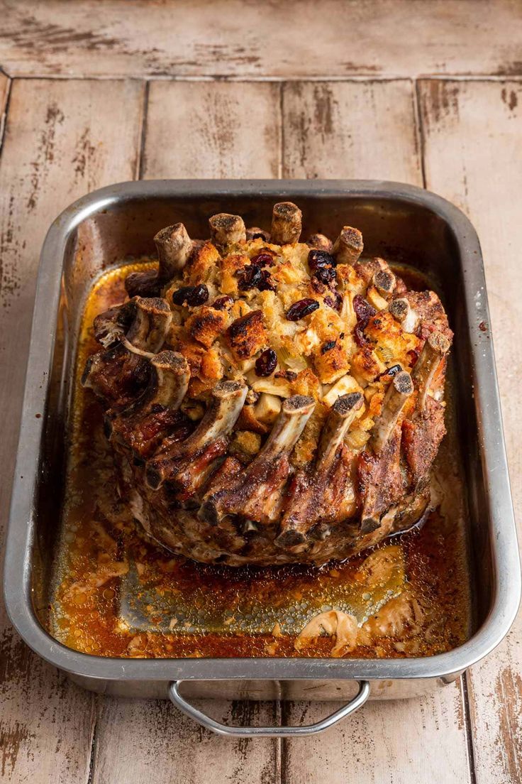 a meatloaf in a pan on a wooden table