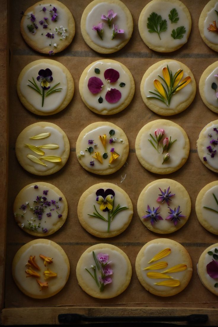 the cookies are decorated with edible flowers