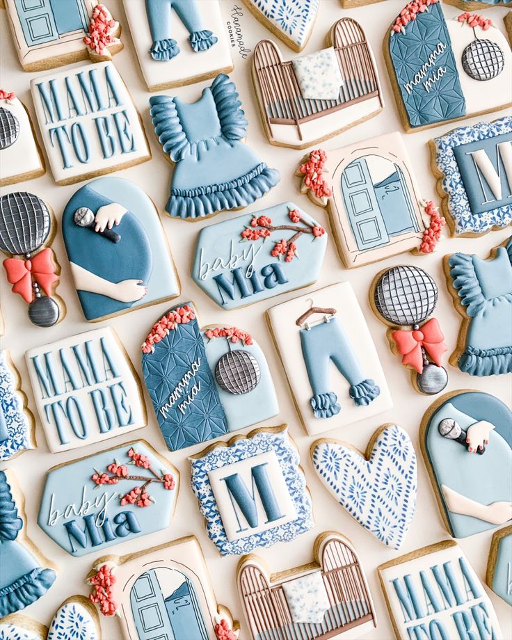 decorated cookies are displayed on a table