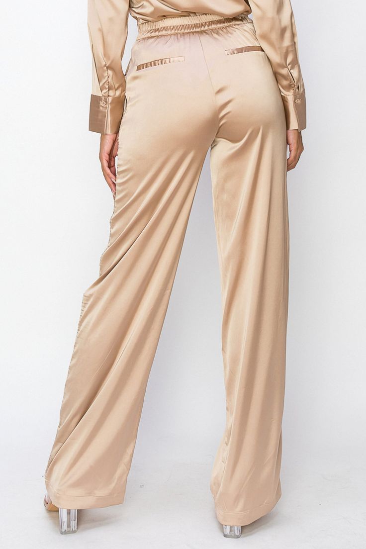 • SKU: P-2140• S-M-L• Hand wash onlyDiscover our Long High-Waist Pants, expertly crafted from premium polyester fabric for a sleek and stylish addition to your wardrobe. These versatile pants feature a flattering high-waisted silhouette that provides both comfort and support, making them the perfect choice for any occasion. Crafted from premium materials, these pants are soft, gentle on your skin, and perfect for any occasion, effortlessly transitioning from day to night. Elastic Waistband Full-length Elastane Pants, Elastane Pants With Elastic Waistband, Fitted Solid Color Trousers, Full Length Elastane Pants With Elastic Waistband, Sleek Satin Pants, Sleek Satin Straight Pants, Sleek Satin Bottoms For Workwear, Spring Satin Straight Leg Pants, Wide Leg Bottoms With Pockets