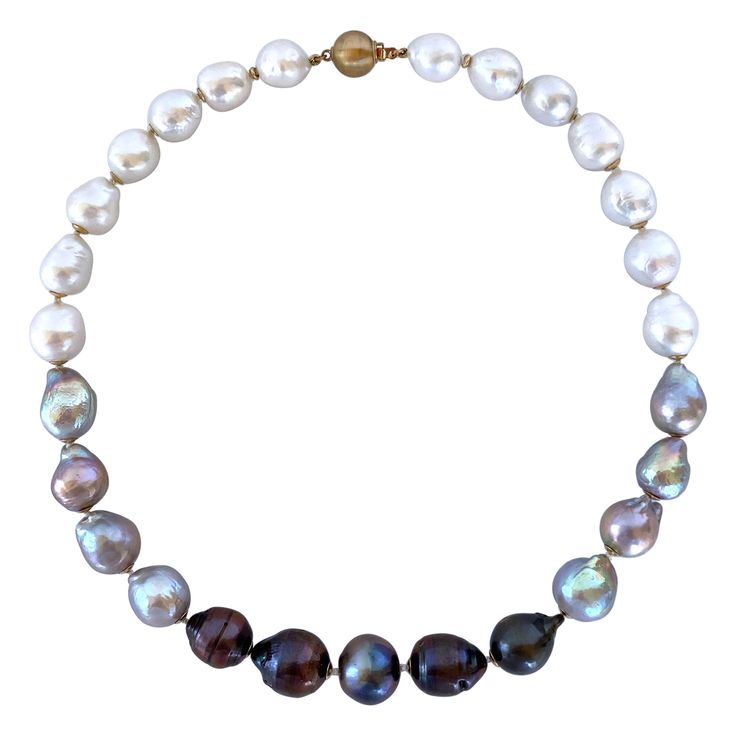 Gorgeous yet simple piece from Marina J. This beautiful necklace features high luster Baroque Black, Grey and White Pearls all carefully strung together to create the perfect ombre. Pearls graduate in size from light to dark, giving this piece a dynamic and dimensional look. Each Pearl displays a wild iridescent "oilspill" sheen and is accented by a 14K Yellow Gold cups. Necklace meets at a secure and decorative 14K Yellow Gold Bead Closure Clasp and measures 17.5 inches long, allowing it to sit Ombre Necklace, South Sea Pearl Necklace, Akoya Pearl Necklace, Necklace Clasp, Pearl Strands Necklace, Golden South Sea Pearls, J Black, White Pearl Necklace, Necklace Clasps