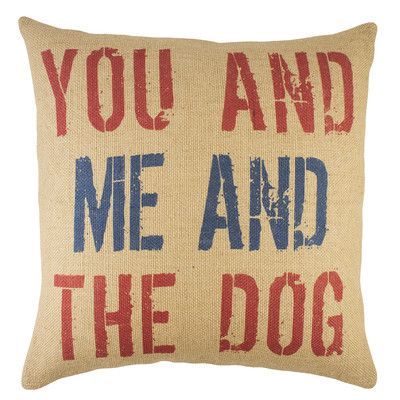 a pillow with the words you and me and the dog on it in black ink