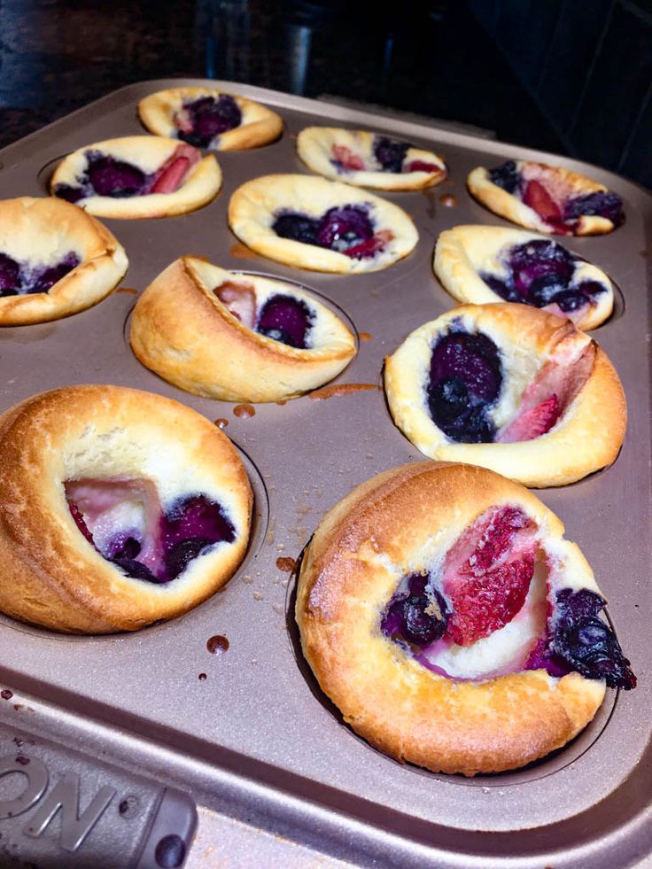 several pastries are sitting in a muffin tin