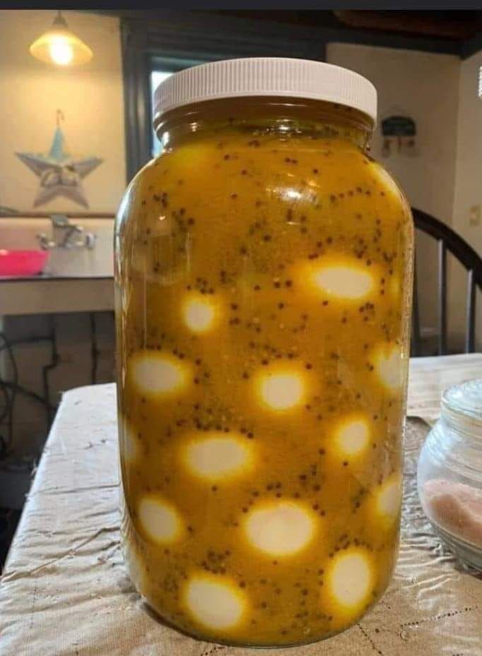 a jar filled with liquid sitting on top of a table