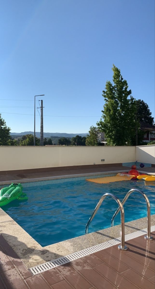 an empty swimming pool with water toys in it