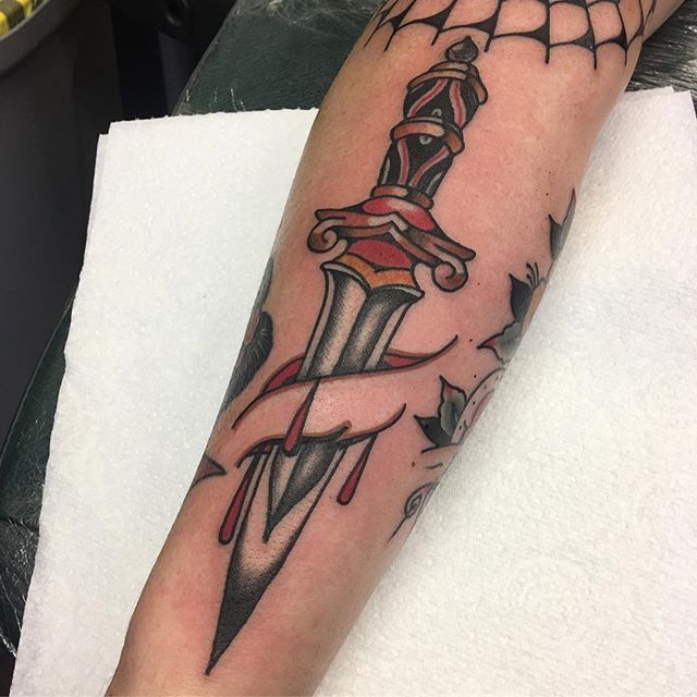 Traditional, dagger stabbed arm tattoo Pirate Themed Tattoos, Rose And Dagger Tattoo, Snake And Dagger Tattoo, Traditional Dagger Tattoo, Traditional Dagger, Pirate Tattoo, Rose Tattoos For Men, Knife Tattoo, Tattoo Old School