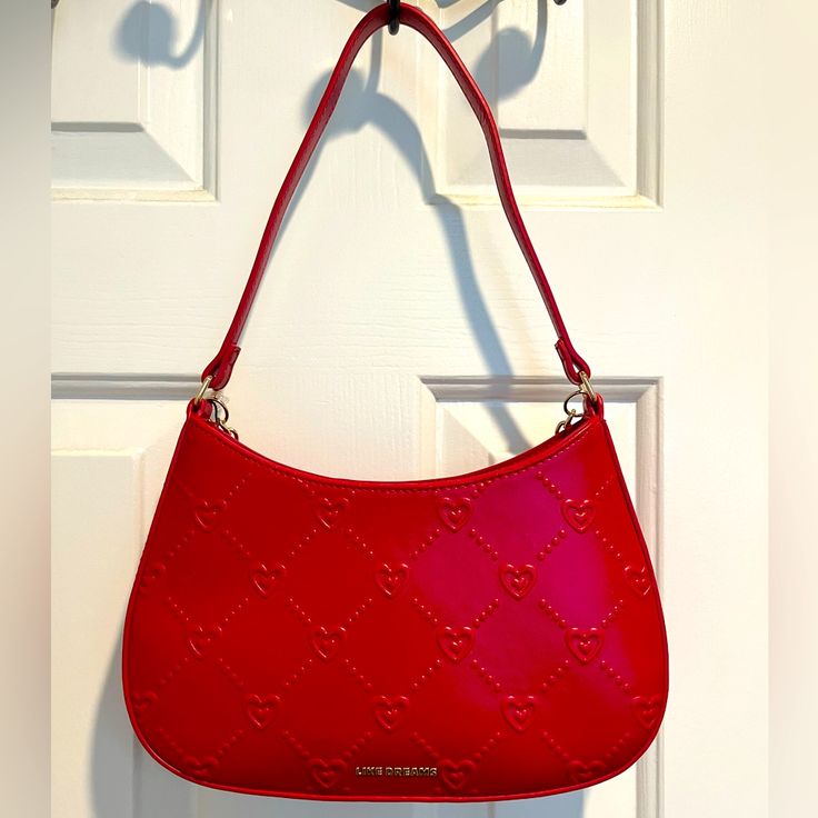 Like Dreams Red Heart With Gold Chain Accent Purse. Brand New With Tags. Red Shoulder Bag For Valentine's Day Shopping, Trendy Red Shoulder Bag For Valentine's Day, Valentine's Day Red Shoulder Bag For Shopping, Red Bags For Valentine's Day, Chic Everyday Shoulder Bag For Valentine's Day, Wishlist 2024, Latest Handbags, Trendy Backpacks, Red Purse