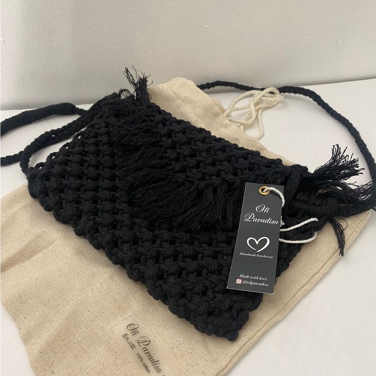 This Beautifully Handcrafted Macram Bag Is Made From 100% Natural Cotton, Giving It A Soft Yet Durable Texture. Carefully Woven With Intricate Patterns, This Bag Adds A Touch Of Boho-Chic Style To Any Outfit. Perfect For Casual Outings, Beach Days, Or Festivals, It’s Both Stylish And Functional With Enough Space For Your Essentials. The Timeless Design And High-Quality Craftsmanship Make This Bag A Versatile Accessory That You’ll Reach For Season After Season. Casual Rectangular Macrame Bag, Eco-friendly Macrame Bag For Everyday Use, Casual Black Crochet Bag For Gift, Black Macrame Crochet Bag For Everyday Use, Casual Macrame Bag For Daily Use, Handwoven Black Shoulder Bag Gift, Handwoven Black Shoulder Bag As Gift, Handwoven Black Shoulder Bag For Gift, Black Rectangular Macrame Bag