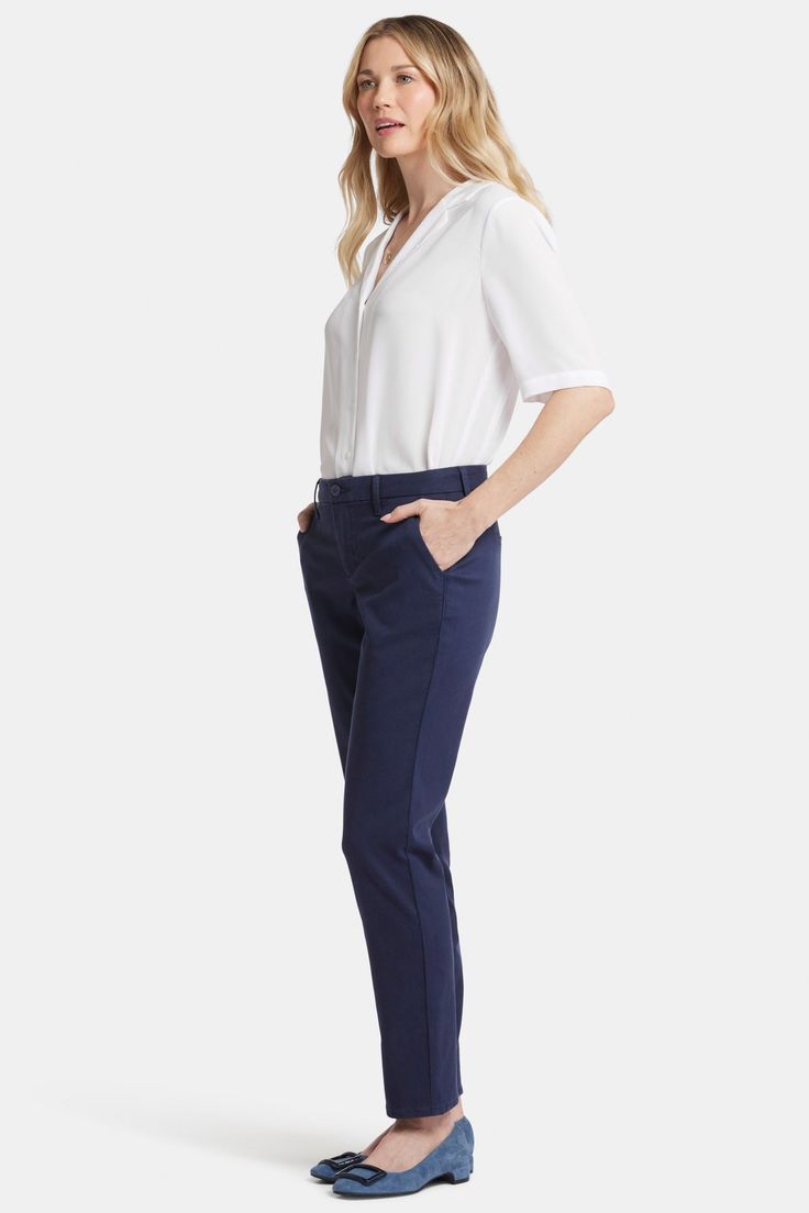 Between skinny and straight, you'll find the perfect body-hugging slim fit in NYDJ's Sheri Slim Trouser Pants in Stretch Twill. They're expertly designed to effortlessly transition from desk to dinner with ease and style. This exceptionally elongating style enhances your assets and streamlines your silhouette with our signature Lift Tuck® Technology, which flattens and flatters using a proprietary slimming panel with a patented criss-cross design. Soft stretch twill provides a comfortable yet polished look. Features back welt pockets and zip fly with button closure. This pant is made with earth-friendly methods that result in reduced consumption of water, chemicals and/or energy. | NYDJ Women's Sheri Slim Trouser Pants in Starless Sky, Regular, Size: 18 Mid-rise Elastane Dress Pants With 4-way Stretch, Slim Fit Ankle-length Dress Pants With Welt Pockets, Slim Fit Ankle-length Pants With Welt Pockets, 4-way Stretch Elastane Pants With Welt Pockets, Blue Stretch Pants With 5-inch Inseam, Slim Trousers, Cross Design, Cross Designs, Perfect Body