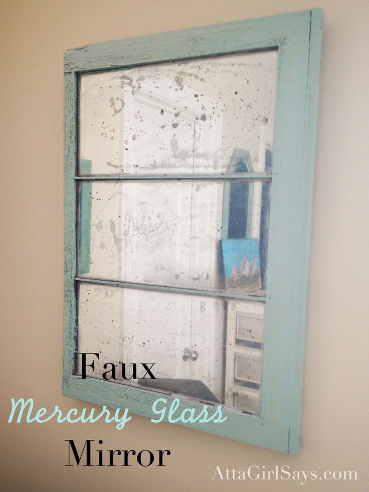 an old window is painted blue and has the words faux memory glass mirror on it