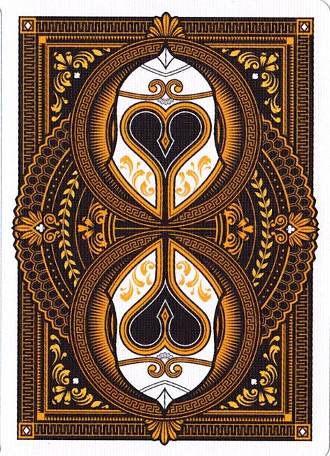 the back side of a playing card with an ornate design on it's sides