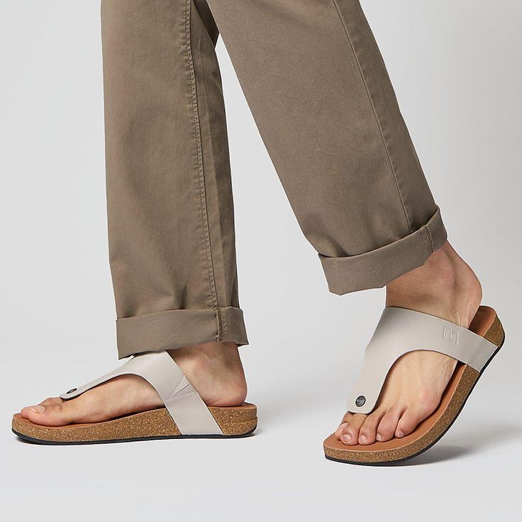 This refined take on our popular iQushion sandal, in soft leather with cork in the sole, is a versatile warm-weather staple – ideal for laidback weekends/holidays but smart enough for around the city or a relaxed workplace. A classic T-bar upper is set on a sleek sole. Leather linings and toe posts feel soft against your feet. With matt brushed-metal studs, and a debossed logo for subtle branding. On our featherlight pressure-diffusing iQushion™ midsole: ergonomically shaped, high-rebound, air-f Casual Cork Footbed Sandals With Leather Footbed, Casual Cork Footbed Sandals For Beach, Comfortable Cork Sandals For Summer, Casual Cork Sandals With Round Toe, Comfortable Cork Sandals For Spring, Casual Slip-on Footbed Sandals With Cork-bed Midsoles, Casual Cork Slip-on Sandals, Casual Toe Post Flip Flops With Leather Footbed, Casual Footbed Sandals With Ortholite Insole For Vacation