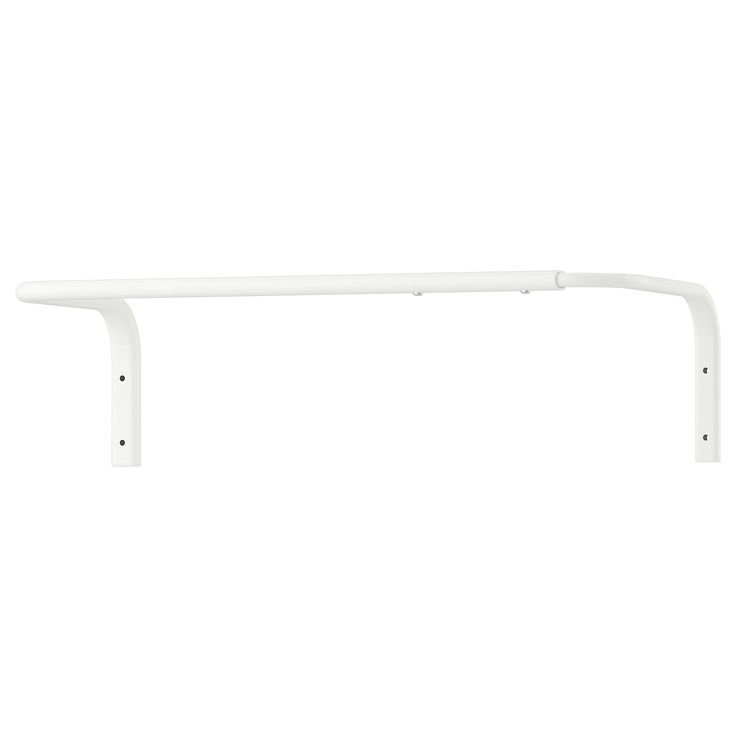 a white shelf sitting on top of a wall