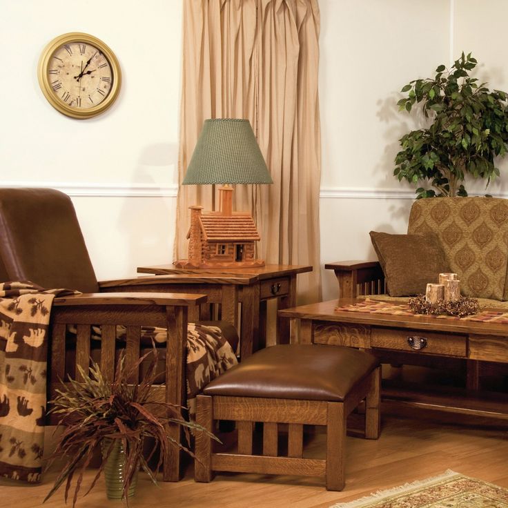 a living room filled with furniture and a clock on the wall