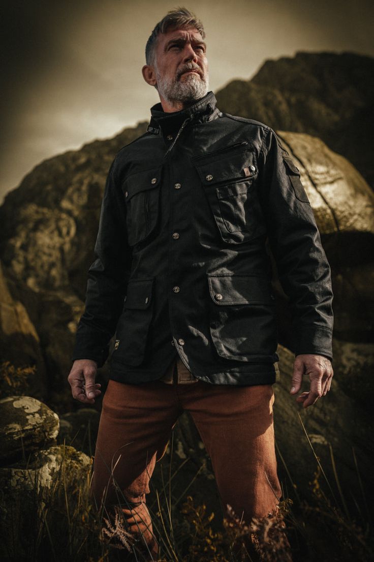 Inspired by the iconic designs of the 1920s, this waxed cotton jacket pays homage to the spirit of exploration and the open road. Crafted using Waxed British Millerain fabric and infused with the distinctive &SONS style, this jacket is a symbol of heritage, durability, and the road less travelled. The fabric, renowned for its quality and craftsmanship, enhances the jacket's weather resistance while giving it a unique finish. Much like the explorers of the 1920s, this jacket matures with age, dev Jacket Drawing, Son Clothes, Waxed Jacket, Waxed Cotton Jacket, Work Wear Outfits, Zip Puller, Wax Jackets, Chore Jacket, The 1920s