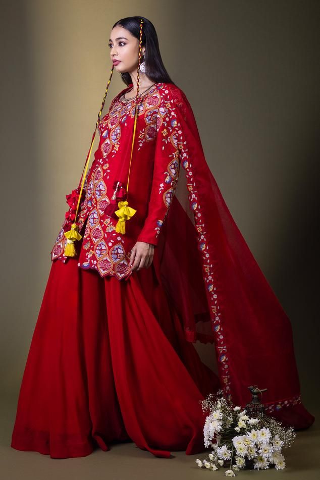 Red kurta with all over floral Mughal pattern and multi color thread embroidery. Paired with flared sharara and embroidered bordered dupatta.
Components: 3
Pattern: Embroidered
Type Of Work: Thread Work
Neckline: Leaf Neck
Sleeve Type: Full Sleeves
Fabric: Raw Silk, Georgette, Organza
Color: Red
Other Details: 
Cut work hem details
Kurta Closure: Front concealed zip
Note: The hair accessory worn by the model is not for sale
Occasion: Wedding,Sangeet - Aza Fashions Unstitched Red Sharara With Sheer Dupatta, Red Sharara With Resham Embroidery And Traditional Drape, Unstitched Red Sharara With Dupatta, Red Sharara With Resham Embroidery, Designer Red Sharara With Dupatta, Designer Red Set With Dupatta, Red Sharara With Dori Work And Traditional Drape, Designer Red Sharara With Zari Work, Red Sharara With Sheer Dupatta In Chanderi