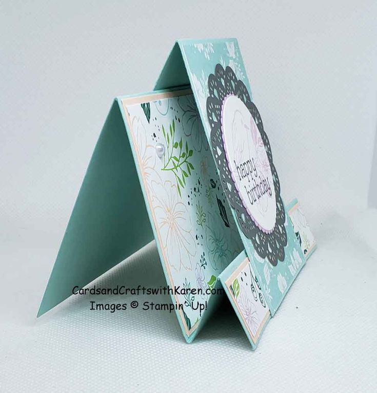 an origami card holder is open and showing the inside of it's cover