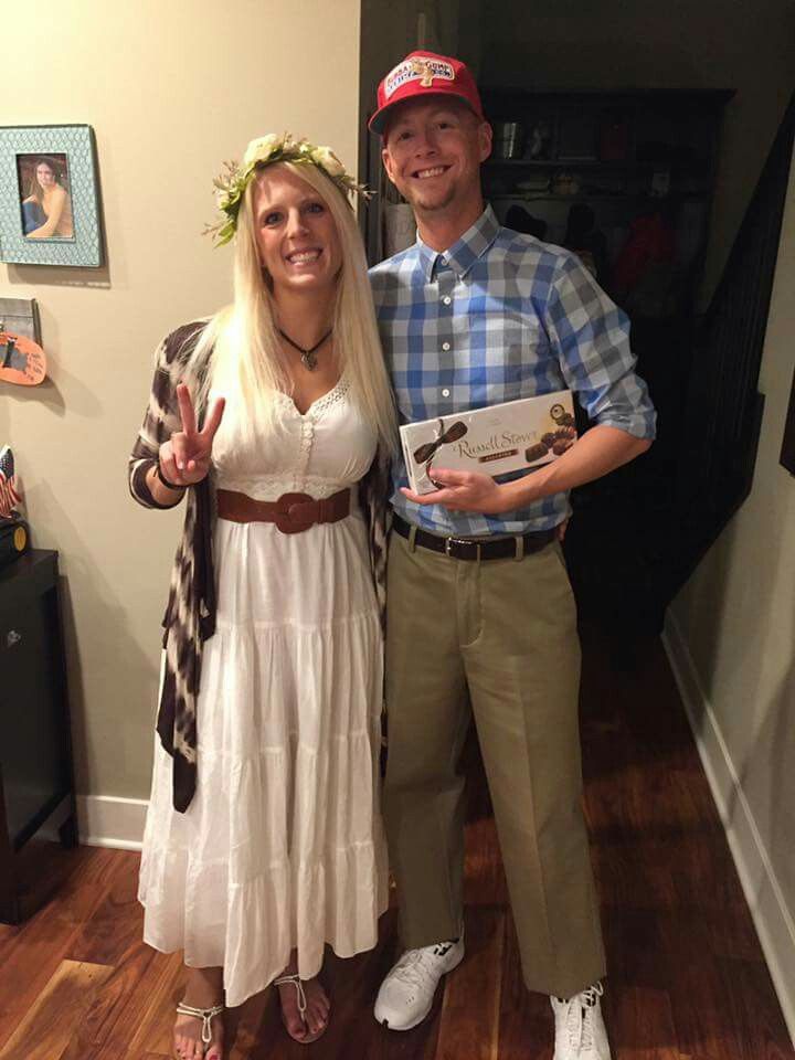 a man and woman standing next to each other on a hard wood flooring floor