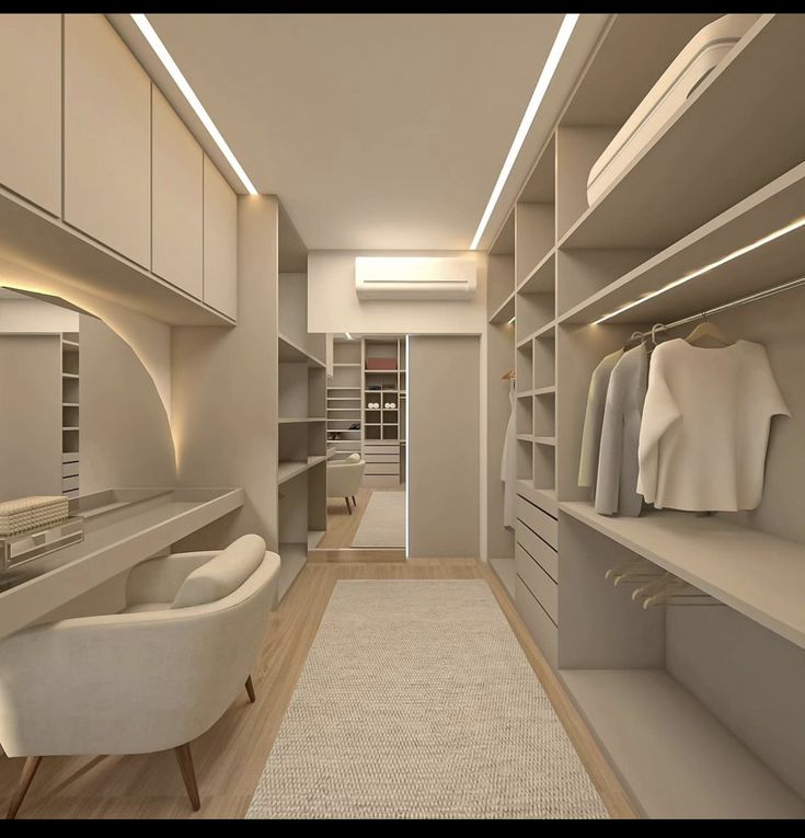 an empty walk in closet with white furniture