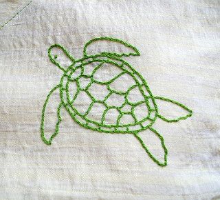 a close up of a piece of fabric with a turtle on it