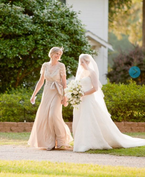 two brides walking down the street in their wedding dresses