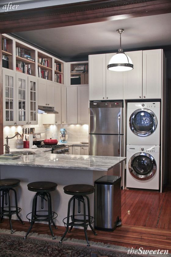 a kitchen with a washer and dryer in it