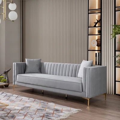 a living room filled with furniture and lots of shelves on the wall next to a window