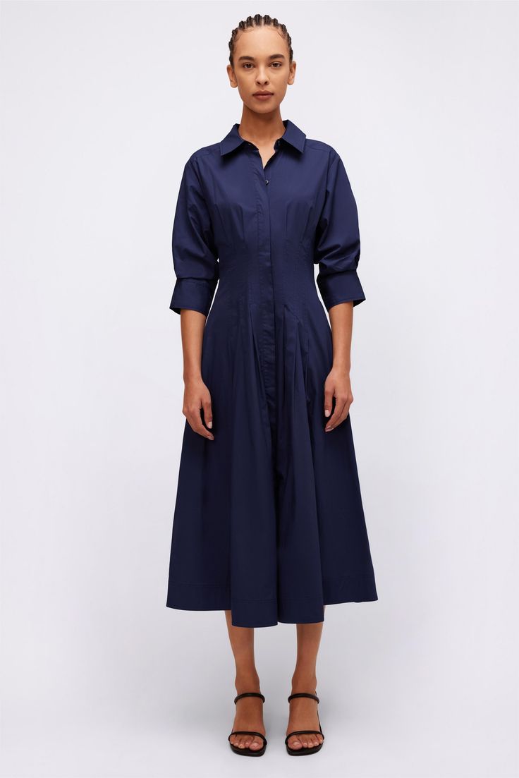 The Jazz Dress in Midnight. Sharp, shirting inspired designs accentuate a pintucked waist, cuffed sleeves and a classic midi length hemline.