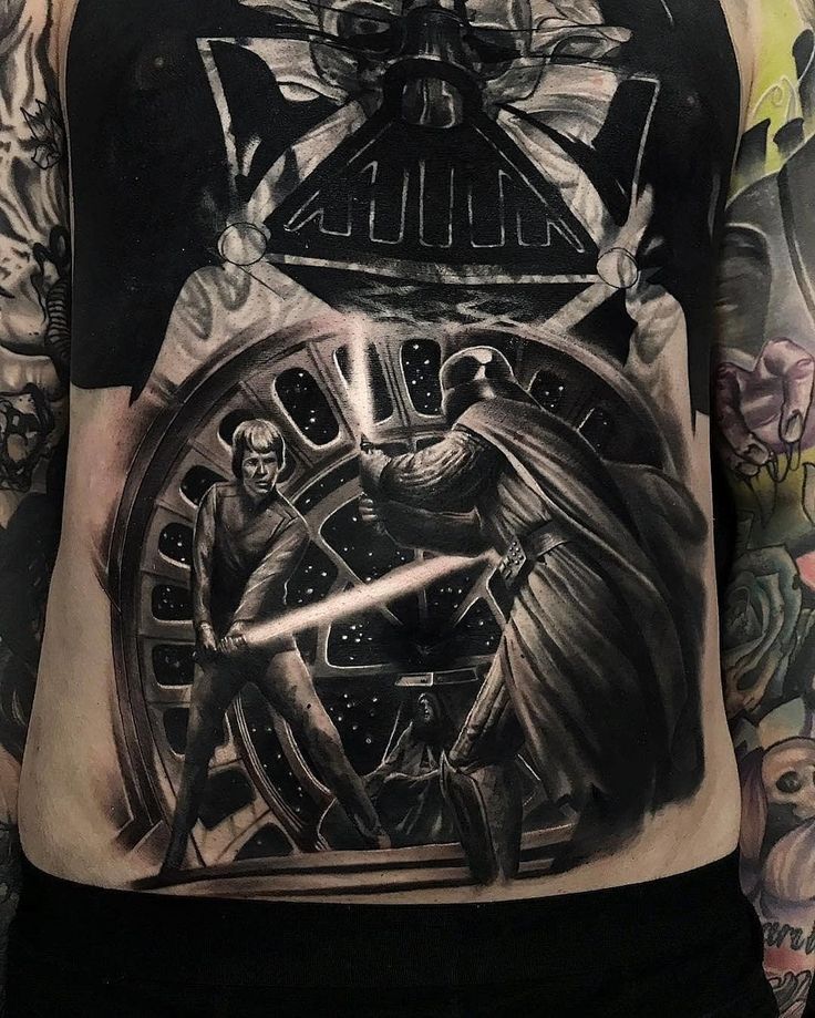 a man with tattoos on his chest has a darth vader tattoo