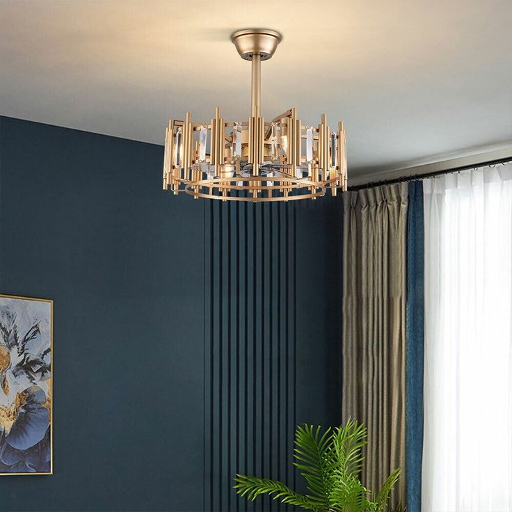 a living room filled with furniture and a chandelier hanging over the top of a table