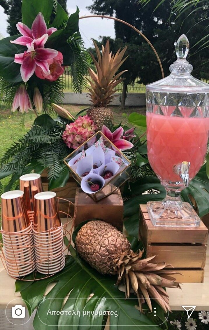 a table topped with lots of different types of drinks