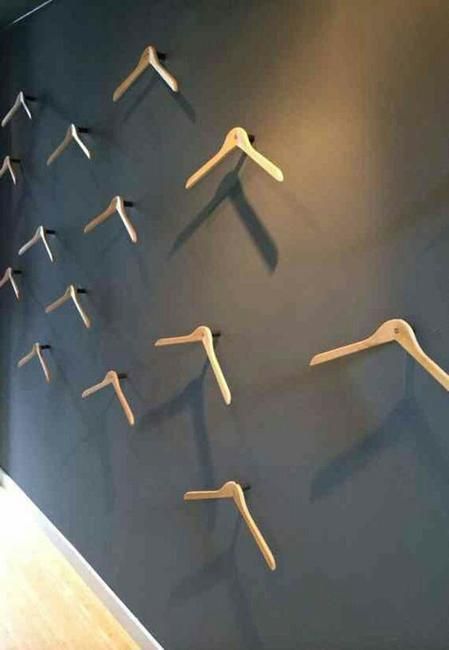 there are many clothes hangers on the wall