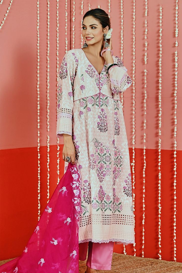 Peach kurta featuring printed floral motifs highlighted with sequin detail on borders and lace. Comes with plain pant and embroidered floral scalloped dupatta.
Components: 3
Pattern: Printed
Type Of Work: Floral
Neckline: V-neck
Sleeve Type: Full
Fabric: Kurta and Pant: Cotton, Dupatta: Organza
Color: Peach
Other Details: 
Schiffli detail on border
Panelled kurta
Piping on edges
Buttoned kurta placket
Occasion: Mehendi and Haldi - Aza Fashions Scalloped Dupatta, Kurta Pant Set, Plain Pants, Cotton Dupatta, Kurta With Pants, Fashion App, Floral Motifs, Pant Set, Set For Women