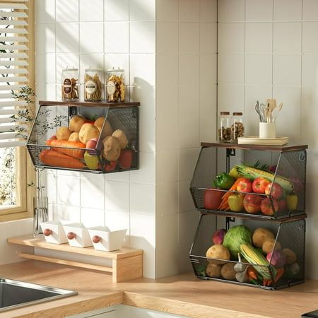 two metal baskets filled with fruits and vegetables on top of a counter next to a sink