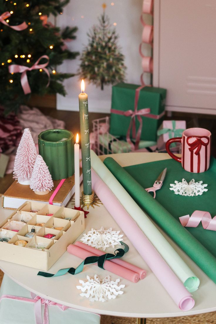 a table topped with lots of presents and candles